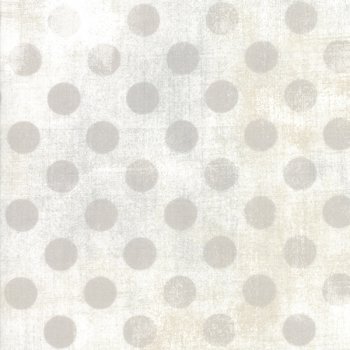 Taupefarbene Punkte auf Graubeige gefleckt