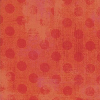 Rote Punkte auf Rotorange gefleckt