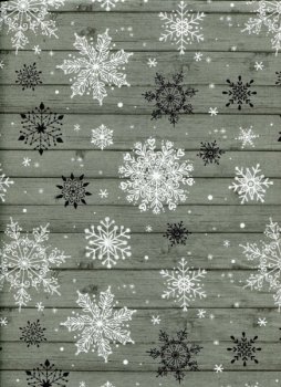 Schneeflocken auf graugrünem Holz