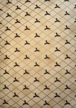 Ilexblätter mit Beeren im Quadrat auf Beige