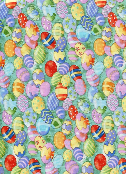 Baumwollstoff Bunte Ostereier im Gras