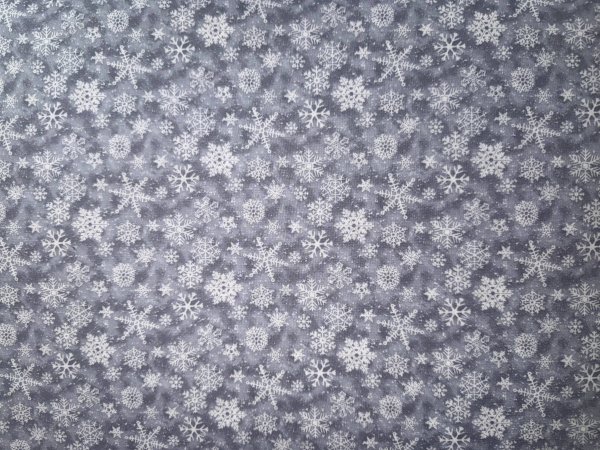 Weiße Schneeflocken auf Grau